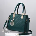 Deep green wing-shaped handbag with geometric texture and clover pearl charm decoration - Dark Green