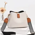 Chic beige bucket bag with litchi grain leather and geometric stripe wide strap - White and Yellow