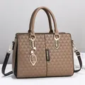 Brown faux leather wing bag with geometric triangle texture and leaf charm detail - Khaki
