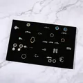 Rectangle black velvet jewelry display tray for rings and earrings on marble background - Black