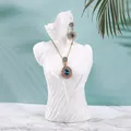 Elegant gold necklace and teardrop blue crystal earrings on white resin mannequin - Medium (25*13*11cm) / White