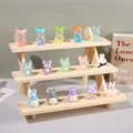 Three-tier wooden display stand featuring colorful resin cartoon charms and animal pendants - Triple Layer