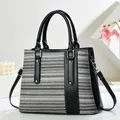 Fashionable woven tote bag for women featuring black faux leather and silver hardware - Striped Pattern / Black