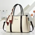 Elegant two-tone bucket handbag with lychee pattern and decorative silk scarf - Off White