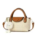 Chic beige woven handbag with brown leather flap and cute plush chick charm - Off White