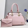 Detail of pink patent leather tote and pouch set with shell hardware and gold chain - 2-Piece Set (Handbag + Envelope Bag) / Pink