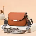 Brown litchi leather saddle bag with geometric wide strap and silver metal buckle - Khaki/Earth Yellow