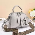 Chic light gray pebbled leather women handbag with wide woven strap and silver hardware - Light Gray