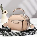 Beige pebble leather crossbody bag with triple zippers and wide printed strap - Apricot