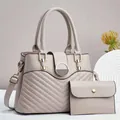 Detail of V-quilted faux leather handbag with metal magnetic closure and matching pouch - Tote Bag And Wallet / Light Gray