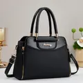 Minimalistische schwarze Damen-Tragetasche aus PU-Leder und Twill mit Goldakzenten - Schwarz