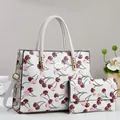 White cherry print handbag and matching long wallet set with gold-tone hardware detail - White