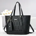 Chic black checkered tote bag set with detachable pouch and elegant gold hardware - Black