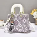 Chic woven tricolor handbag with white leather handles and a cute cartoon charm - White