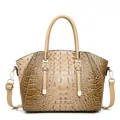 Detail of khaki crocodile pattern handbag with golden hardware and adjustable strap - Khaki
