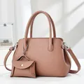 Pink lychee texture leather tote bag with matching coin purse pendant and top handles - Pink