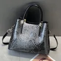 Vintage glossy snakeskin print handbag with dual handles and gold hardware for women - Gray