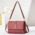 Reddish-brown litchi pattern leather crossbody bag with elegant gold buckle detail - Style 1 (U-Shaped Buckle) / Pink
