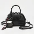 Classic black square shoulder bag in glossy oil wax leather with a top handle and strap - Black