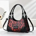 Fashionable red leopard print patent leather handbag with rivets and cross-body strap - Burgundy