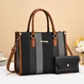 Detail of striped tote bag and matching clutch set with brown leather straps and accents - Black