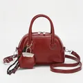 Retro dark red square shoulder bag in glossy pebbled leather with star charm - Red