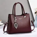 Elegant burgundy leather handbag with pearl leaf pendant for mothers on office commute - Burgundy