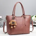 Dusty pink multi-functional bucket tote bag with adjustable strap and plush charm - Pink