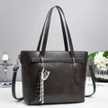 Dark brown faux leather tote bag with shoulder straps and detachable crossbody strap - Gray