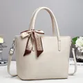Elegant beige PU leather tote bag with a decorative silk scarf and silver hardware - Off White