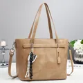 Classic tan faux leather tote bag with braided tassel and adjustable shoulder strap - Khaki
