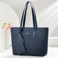 Large dark blue woven texture tote bag with matching coin purse on a geometric stand - Blue