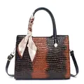 Women's brown crocodile pattern tote bag with top handles and decorative silk scarf - Earthy Yellow