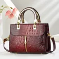 Burgundy faux crocodile leather handbag with gold ring handles and adjustable shoulder strap - Burgundy