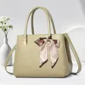 Pistachio green woven textured tote bag with striped silk scarf and long shoulder strap - Green
