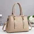 Detail of beige tote bag featuring textured 4G logo embossing and gold-tone hardware accents - Apricot
