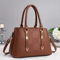 Brown lychee texture handbag with square embossing and golden metal hardware - Earthy Yellow