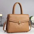 Elegant caramel leather crossbody bag with diamond stitching and gold twist lock - Khaki