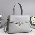 Gray quilted crossbody handbag for women with gold twist lock and adjustable strap - Gray