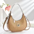 Sac hobo vintage kaki tissé en forme de croissant avec logo oiseau et métal argenté - Kaki