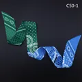 Close-up of a double-sided Twilly scarf with green and blue paisley patterns - Green And Blue(C50-1)
