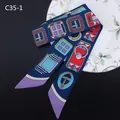 Detail of navy blue twilly silk scarf with geometric patterns on a decorative plate - Dark Blue Geometric Style (C35-1)