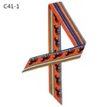 Macro detail of twilly scarf with horse silhouettes and classic orange striped edges - Orange (C41-1)