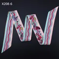 Detailed wave fold of silk-like scarf featuring vibrant floral prints on pink base - Pink Style (X208-6)