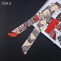 Zebra print skinny silk scarf with orange accents and diagonal cut ends on a magazine - Apricot Zebra Style (C14-2)