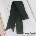 Detail of forest green satin ribbon scarf with texture and material label - 200cm / Forest Green