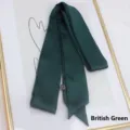 Detailed view of British Green handmade silk-like ribbon with double stitched sharp ends - 200cm / British Green