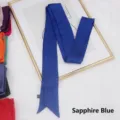 Close-up of royal blue satin handbag scarf ribbon on artistic frame with wash label - 200cm / Sapphire Blue