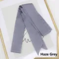 Macro detail of haze grey satin ribbon scarf with swallowtail ends on a minimalist tray - 200cm / Haze Grey