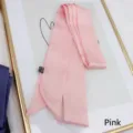 Detail of pink long silk scarf texture with care label on elegant golden frame - 200cm / Pink
